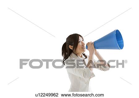 Stock Image - Businesswoman with a megaphone. Fotosearch