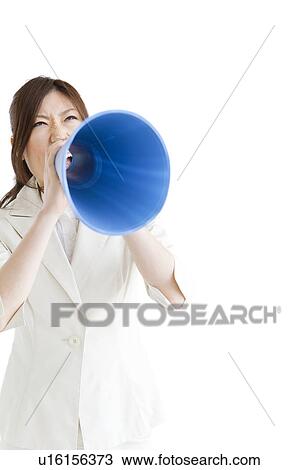 Stock Image - Businesswoman with a megaphone. Fotosearch