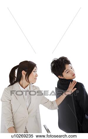 Stock Photography - Businesswoman with hand on businessman's shoulder. Fotosearch
