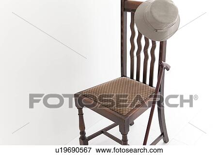 Stock Photo - Chair, hat and walking cane. Fotosearch