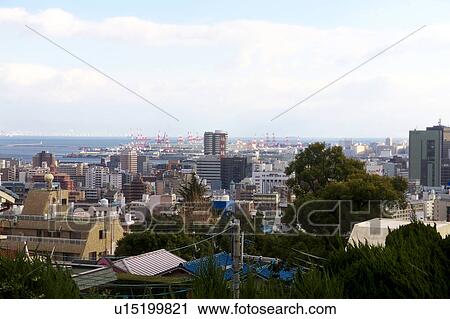 Stock Image - Cityscape of Kobe and Kobe Harbor. Fotosearch