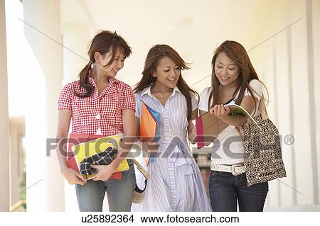 Picture - College students walking in corridor, Guam, USA. Fotosearch