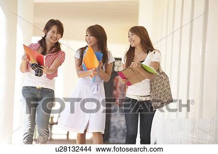 Picture - College students walking in corridor, Guam, USA. Fotosearch