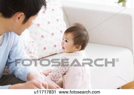 Daughter looking at father View Large Photo Image Stock Image - Daughter looking at father. Fotosearch