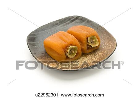 Dried persimmons on a plate View Large Photo Image Stock Image - Dried persimmons on a plate. Fotosearch