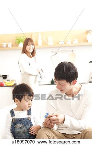 Family at kitchen and living room View Large Photo Image Stock Image - Family at kitchen and living room. Fotosearch