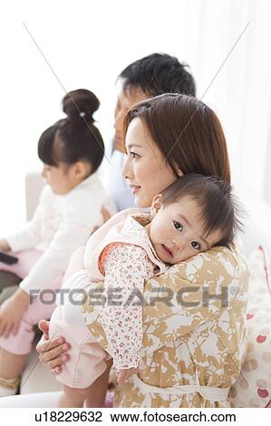 Family watching television View Large Photo Image Stock Image - Family watching television. Fotosearch