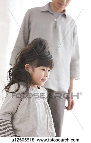 Stock Photo - Father and daughter standing. Fotosearch