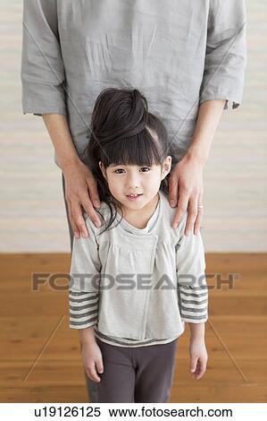Stock Photography - Father and daughter standing. Fotosearch