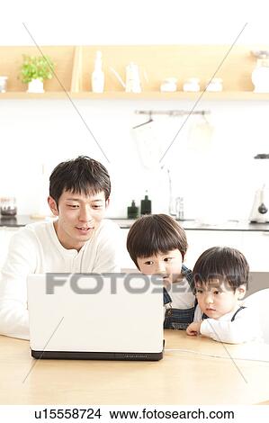 Father and sons using laptop View Large Photo Image Picture - Father and sons using laptop. Fotosearch