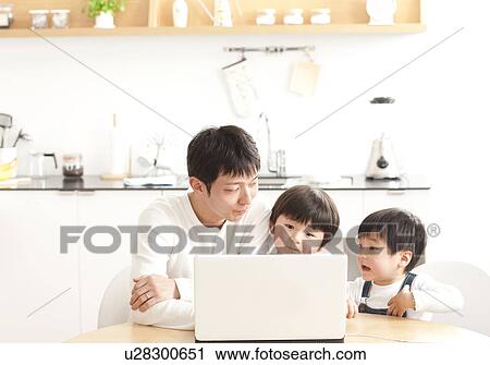 Father and sons using laptop View Large Photo Image Stock Image - Father and sons using laptop. Fotosearch