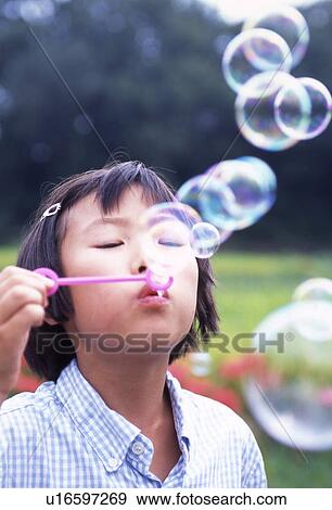 Girl Blowing Bubbles View Large Photo Image Stock Photo - Girl Blowing Bubbles. Fotosearch
