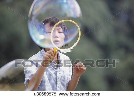 Girl Blowing Bubbles View Large Photo Image Stock Photography - Girl Blowing Bubbles. Fotosearch