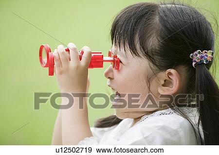 Girl looking through binoculars View Large Photo Image Stock Photo - Girl looking through binoculars. Fotosearch