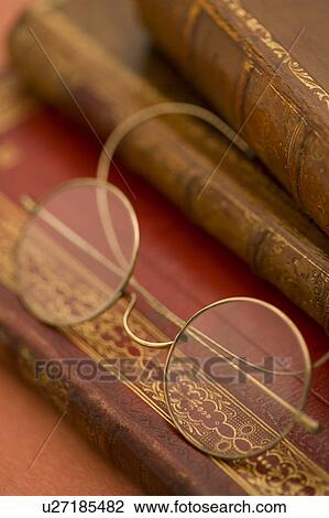 Glasses on Antique Books View Large Photo Image Stock Image - Glasses on Antique Books. Fotosearch