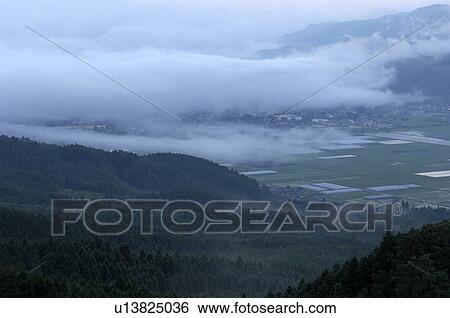 Stock Photograph - High Angle View of Valley at Dawn. Fotosearch
