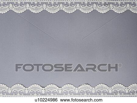 Stock Photograph - Lace and grey background. Fotosearch