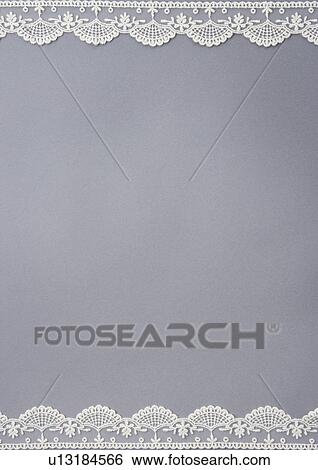 Stock Photograph - Lace and grey background. Fotosearch