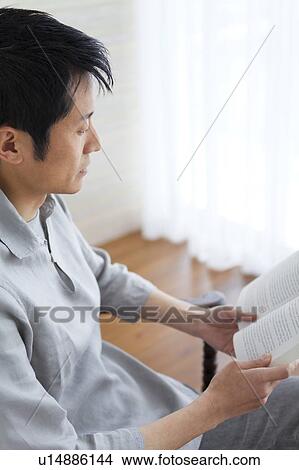 Man reading a book View Large Photo Image Picture - Man reading a book. Fotosearch