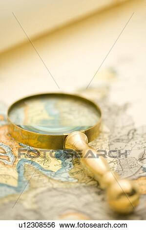 Stock Photograph - Map and Magnifying Glass. Fotosearch