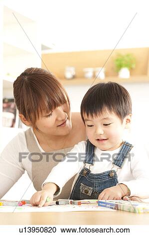 Mother and son drawing with crayon View Large Photo Image Stock Image - Mother and son drawing with crayon. Fotosearch