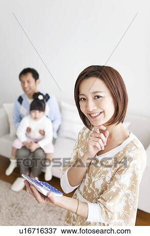 Mother with calculator View Large Photo Image Stock Photo - Mother with calculator. Fotosearch