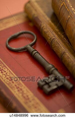 Stock Photograph - Old Books and Key. Fotosearch