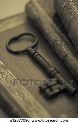 Old Key on Harback books View Large Photo Image Stock Image - Old Key on Harback books. Fotosearch