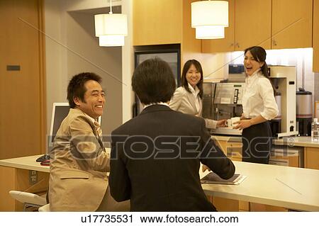 Stock Image - People talking at lounge. Fotosearch