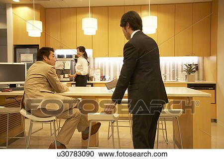 Stock Image - People talking at lounge. Fotosearch