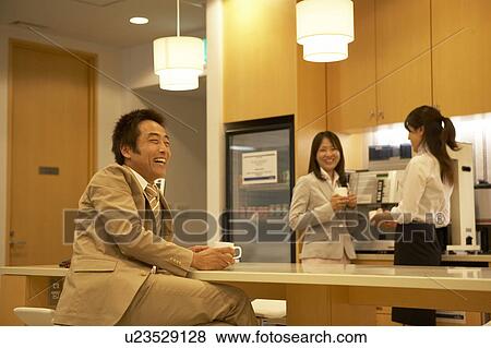 Stock Photo - People talking at lounge. Fotosearch