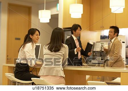 Stock Photography - People talking at lounge. Fotosearch