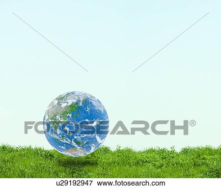 Planet earth floating on grass, Digital Composite View Large Photo Image Stock Photo - Planet earth floating on grass, Digital Composite. Fotosearch