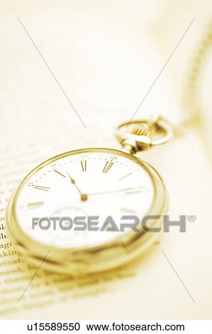 Stock Image - Pocket Watch and Book. Fotosearch