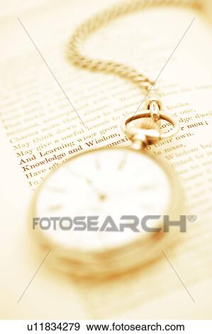 Stock Photo - Pocket Watch and Book. Fotosearch
