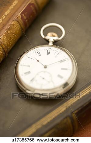 Stock Photograph - Pocket Watch and Book. Fotosearch