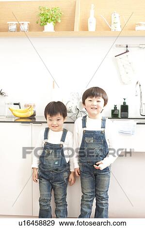 Portrait of brothers in a kitchen View Large Photo Image Stock Photo - Portrait of brothers in a kitchen. Fotosearch