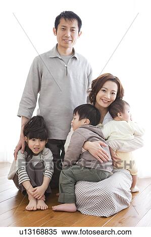 Portrait of family sitting on hardwood floor View Large Photo Image Stock Photography - Portrait of family sitting on hardwood floor. Fotosearch