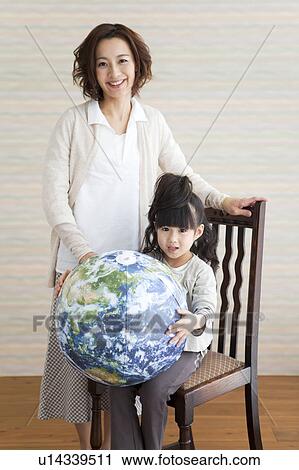 Stock Image - Portrait of mother and daughter. Fotosearch