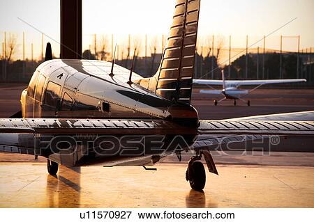 Stock Photo - Propeller Airplane at Sunset. Fotosearch