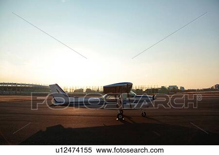 Stock Photography - Propeller Airplane at Sunset. Fotosearch