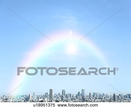 Stock Photography - Rainbow over cityscape. Fotosearch