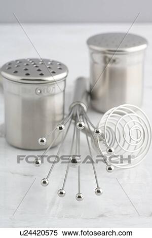 Stock Photography - Salt and Pepper Shakers and Whisk. Fotosearch