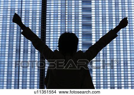 Silhouette of businesswoman stretching by window View Large Photo Image Picture - Silhouette of businesswoman stretching by window. Fotosearch