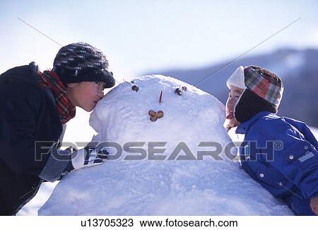 Sister and Brother Kissing Snowman View Large Photo Image Stock Image - Sister and Brother Kissing Snowman. Fotosearch