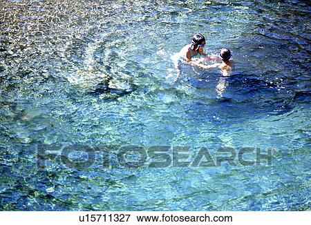 Sister and Brother Swimming View Large Photo Image Stock Photo - Sister and Brother Swimming. Fotosearch