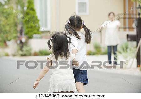 Stock Photo - Sisters running toward mother. Fotosearch
