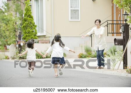 Sisters running toward mother View Large Photo Image Stock Photo - Sisters running toward mother. Fotosearch