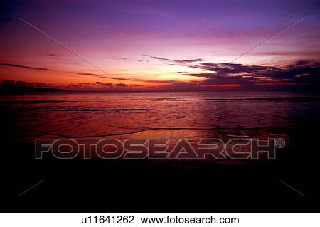 Stock Image - Sunset at Jimbaran. Fotosearch