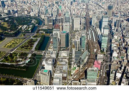Stock Image - Tokyo Station and Imperial Palace Park. Fotosearch